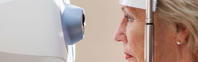 An old woman undergoing eye exam